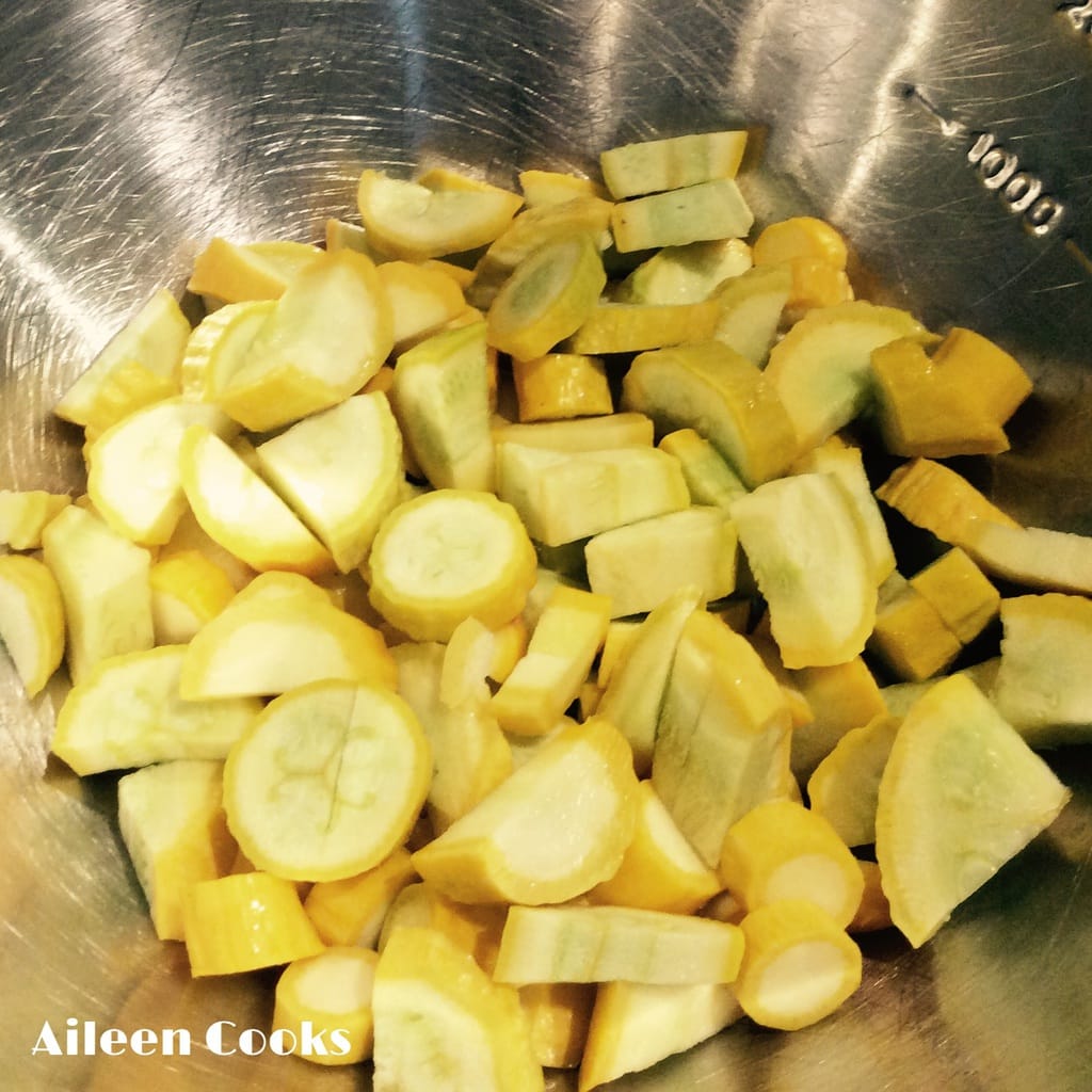 A bowl of summer squash, ready to be added to black bean casserole