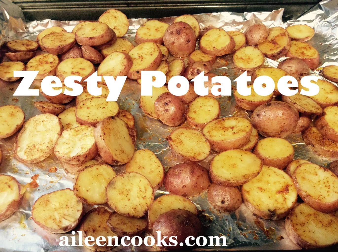 Roasted red potatoes recipe all golden brown on a foil-lined cookie sheet.