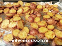 A cookie sheet filled with the roasted red potatoes recipe.