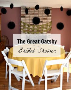 The Great Gatsby Themed Bridal Shower. This Roaring 20s inspiring wedding shower was full of flapper dresses, feathers, glitter, and pearls. They served a champagne brunch including mimosa bar and french toast cups. | aileencooks.com
