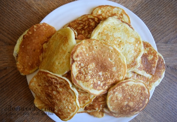 A plate piled high with pancakes.