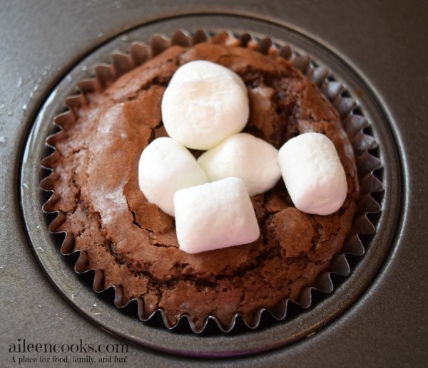 S'mores Brownie Cups made with brownies in a muffin tin and topped with mini marshmallows and graham crackers. Enjoy summer any time!