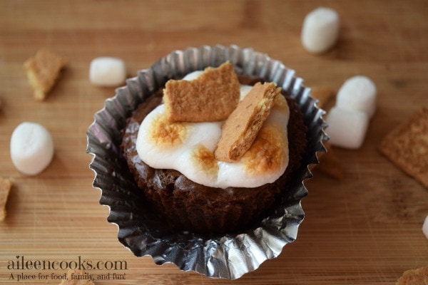 S'mores Brownie Cups made with brownies in a muffin tin and topped with mini marshmallows and graham crackers. Enjoy summer any time!