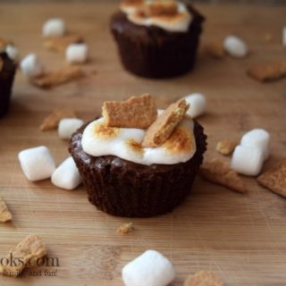 S'mores Brownie Cups made with brownies in a muffin tin and topped with mini marshmallows and graham crackers. Enjoy summer any time!