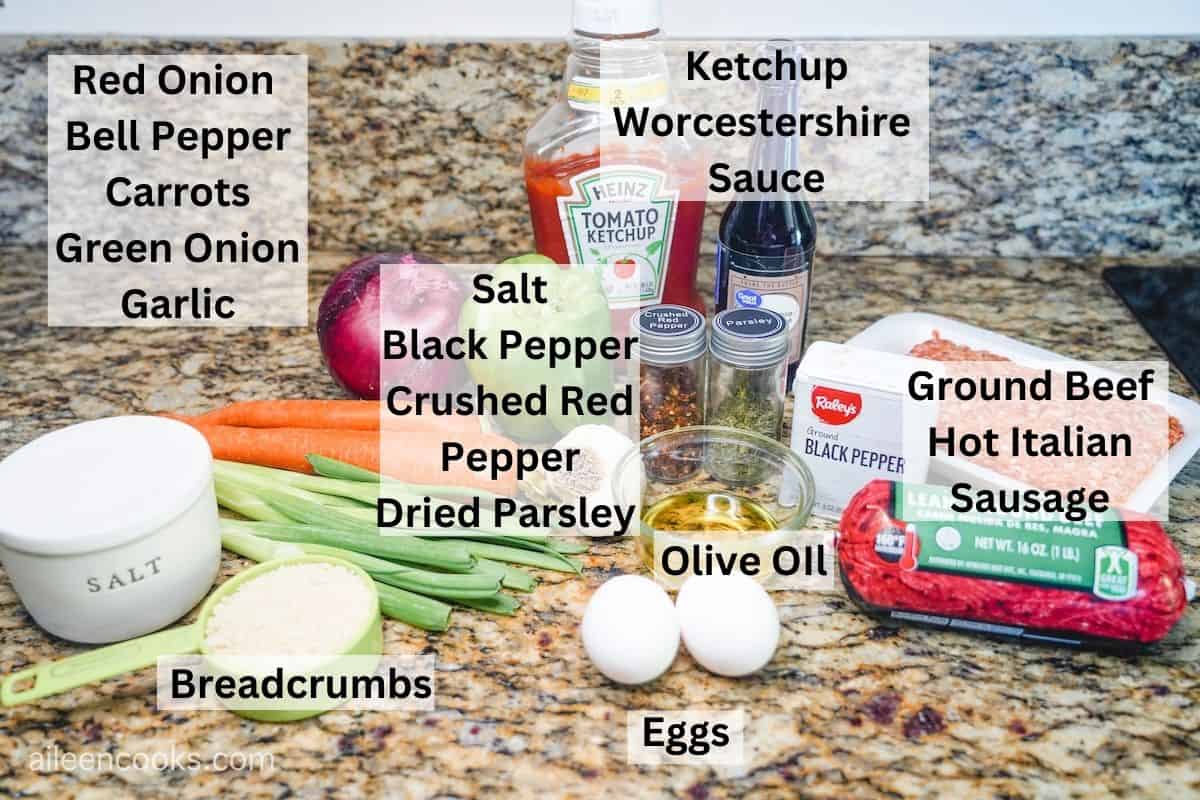 Ingredients for meatloaf labeled and laid out on a kitchen counter.