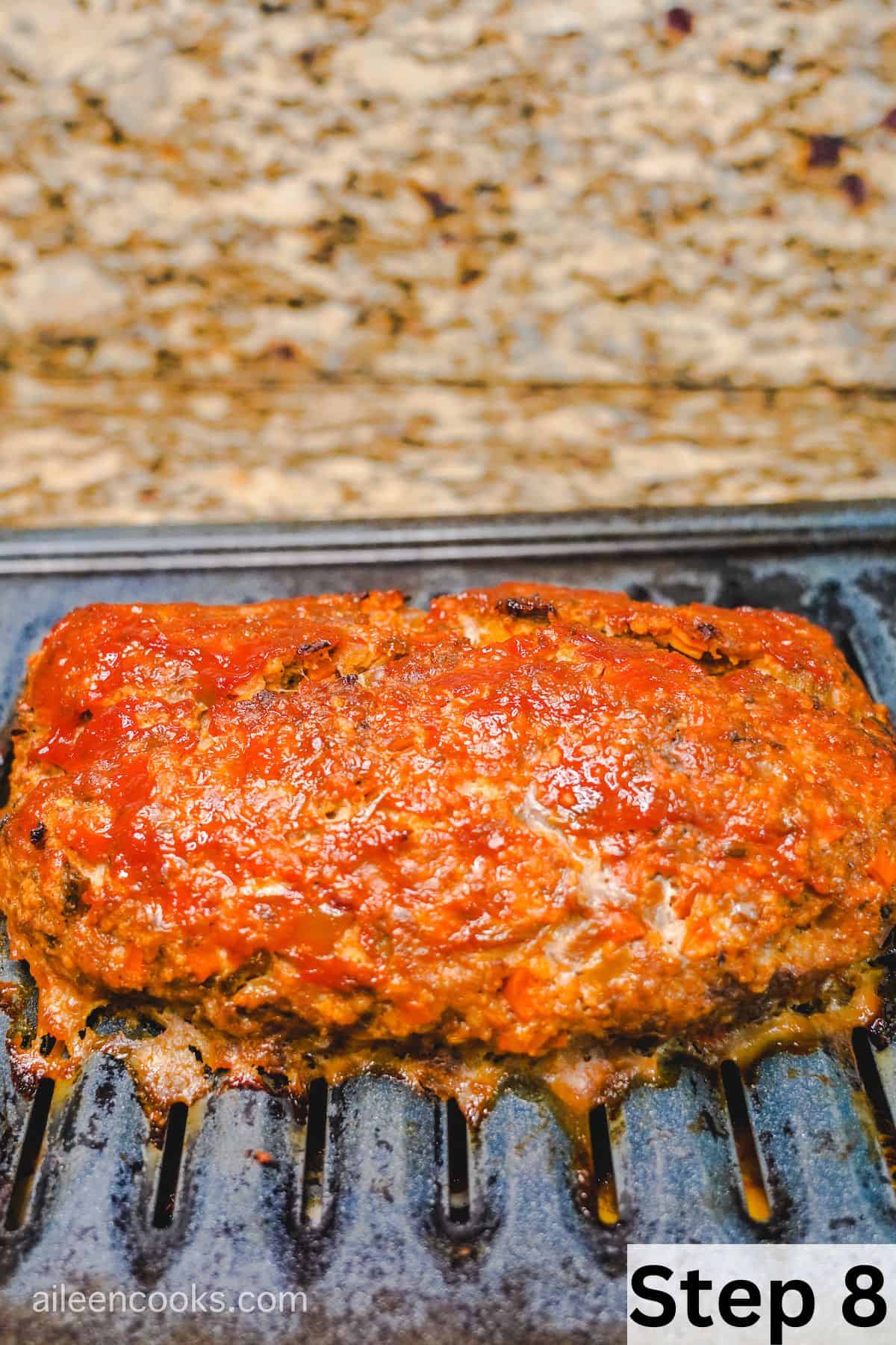 Baked meatloaf on to of a broiler pan.