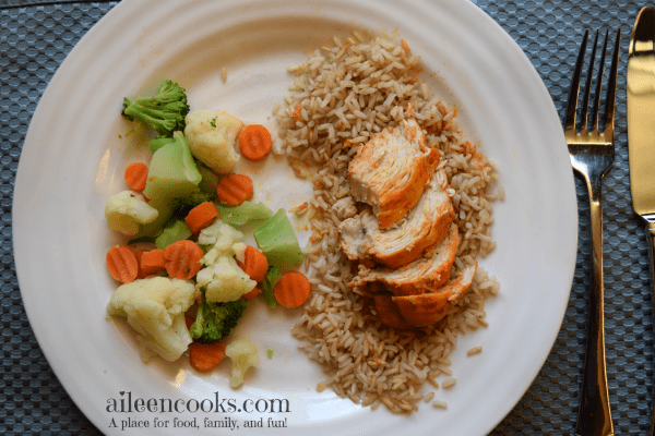 Easy and healthy crockpot buffalo chicken with just 4 ingredients make this slow cooker chicken dinner the perfect weeknight meal. Recipe from aileencooks.com