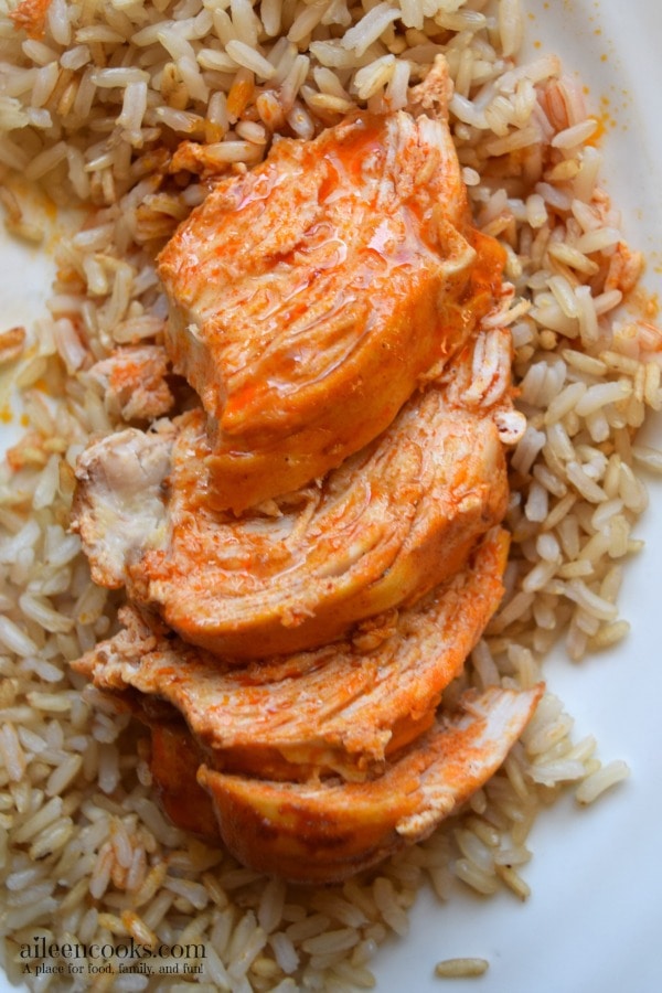 Easy and healthy crockpot buffalo chicken with just 4 ingredients make this slow cooker chicken dinner the perfect weeknight meal. Recipe from aileencooks.com