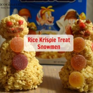 Fun and festive rice krispie treat snowmen made with rice krispies, cocoa krispies, and holiday rice krispies. Such a fun christmas tradition! Cooking With Kids Recipe from aileencooks.com #TidingsAndTreats #ad