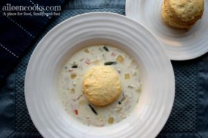 Hearty and deliciuos crockpot chicken pot pie soup is a kid-friendly slow cooker soup - especially when topped with biscuits! Recoipe from aileencooks.com