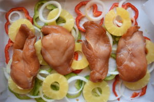 Baked Teriyaki Chicken with Pineapple, red and green peppers, and sweet onions. Served over a bed of brown rice. This easy weeknight meal is healthy and kid friendly. Recipe from aileencooks.com. #ad #stirupthefun @minutericeUS, @DoleSunshine, @kikkomanusa