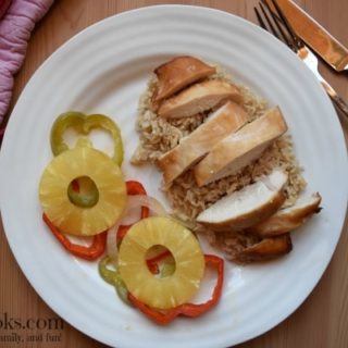 Baked Teriyaki Chicken with Pineapple, red and green peppers, and sweet onions. Served over a bed of brown rice. This easy weeknight meal is healthy and kid friendly. Recipe from aileencooks.com. #ad #stirupthefun @minutericeUS, @DoleSunshine, @kikkomanusa