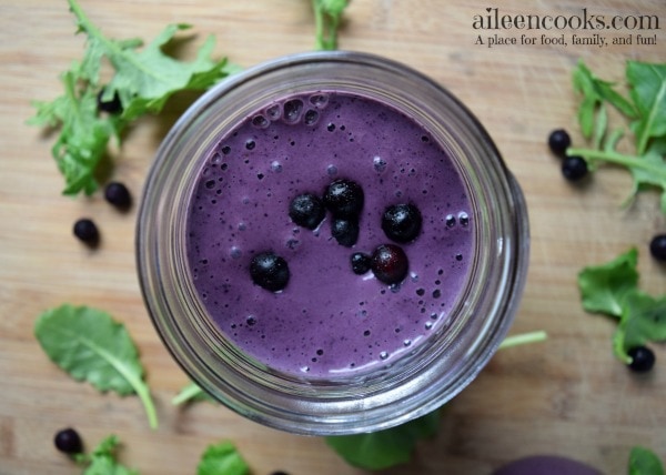 Blueberry Kale Smoothie packed with frozen blueberries, healthy kale, creamy greek yogurt, protein powder, almond milk, and banana. Healthy smoothie recipe. Healthy breakfast recipe. Recipe from aileencooks.com.