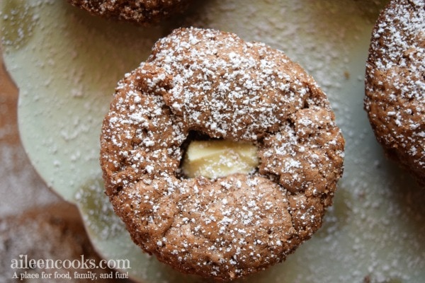 Molten Flourless Chocolate Cupcakes with a white chocolate molten center. Recipe from aileencooks.com.