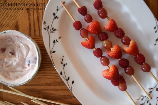 Make this healthy valentine's day snack for kids. Fruit Kabobs with Strawberry Dip. This is a yummy and healthy snack that is perfect for a cooking with kids activity. Recipe from aileencooks.com.