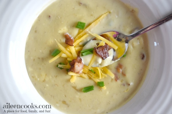 So good! Instant Pot Potato Soup loaded with yukon gold potatoes, bacon, half and half, 2 different kinds of cheeses, and topped with green onions. Easy to make in the instant pot electric pressure cooker. soup recipes. instant pot recipes. baked potato soup recipes. Recipe from aileencooks.com.