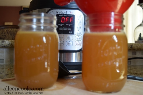 Make healthy and homemade chicken broth in under an hour with the instant pot! Recipe for Instant Pot Chicken Stock from aileencooks.com.