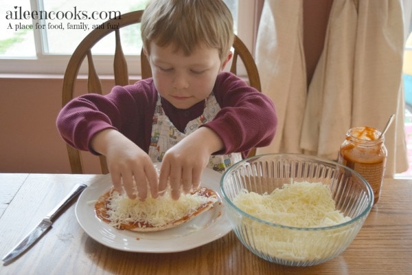 Cooking With Kids: Colorful Pita Pizzas. Get your kids in the kitchen with this fun and flavorful recipe for kids. Recipe from aileencooks.com.