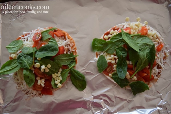 Cooking With Kids: Colorful Pita Pizzas. Get your kids in the kitchen with this fun and flavorful recipe for kids. Recipe from aileencooks.com.