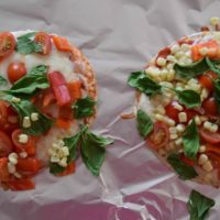 Cooking With Kids: Colorful Pita Pizzas. Get your kids in the kitchen with this fun and flavorful recipe for kids. Recipe from aileencooks.com.