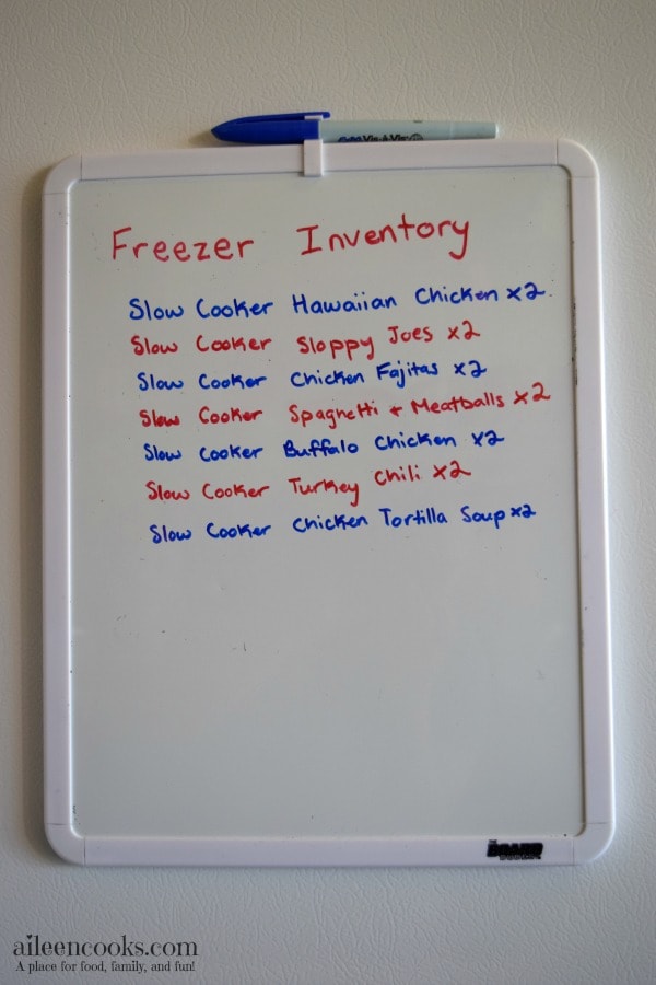 A white dry erase board with a list of crockpot freezer meals.