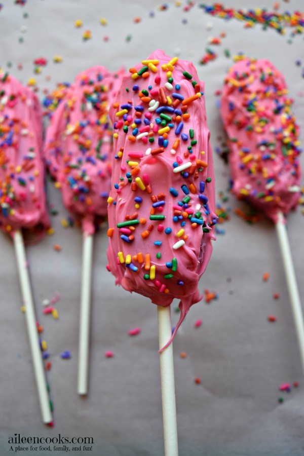 Easy and fun birthday cake twinkie pops are easy to make for a birthday party, back to school, lunch box treat, or just because! My kids love birthday cake twinkies on a stick, too! They are just like cake pops, but bigger and easier!