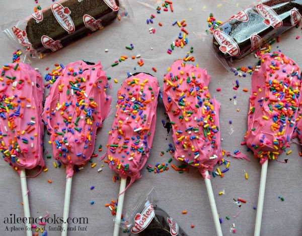 Easy and fun birthday cake twinkie pops are easy to make for a birthday party, back to school, lunch box treat, or just because! My kids love birthday cake twinkies on a stick, too! They are just like cake pops, but bigger and easier!