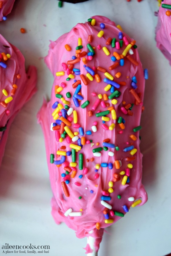 Easy and fun birthday cake twinkie pops are easy to make for a birthday party, back to school, lunch box treat, or just because! My kids love birthday cake twinkies on a stick, too! They are just like cake pops, but bigger and easier!