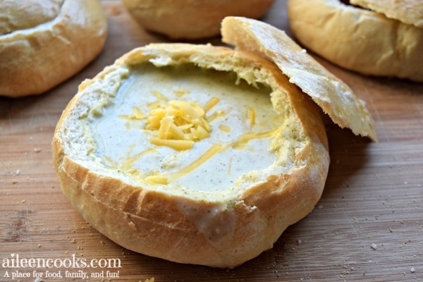 Fresh baked Italian bread bowls recipe with broccoli cheese soup inside.