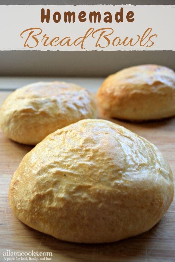 Three homemade bread bowls recipe on a cutting board.