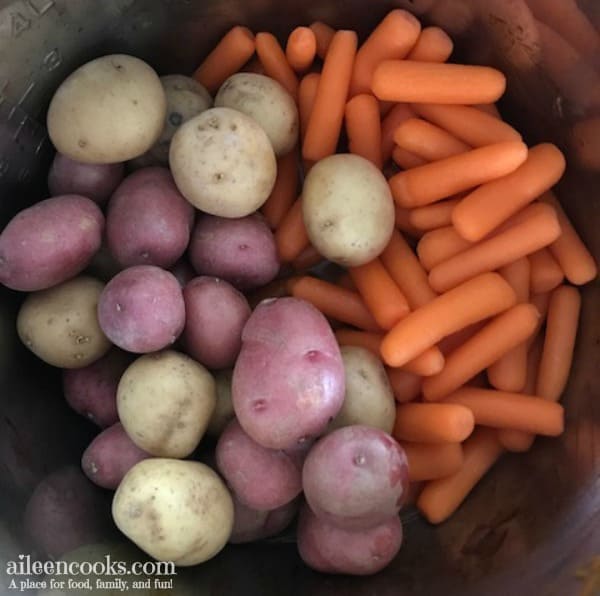 Instant pot meatloaf with potatoes and carrots is a pot in pot recipe for the instant pot electric pressure cooker. This meatloaf is filled with ground beef, italian sausage, carrots, onions, and lots of delicious spices! It's the perfect comfort food!