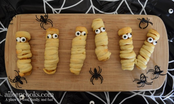 Halloween Mummy Chicken Fries. A fun twist on mummy dogs using crescent rolls and chicken fries.