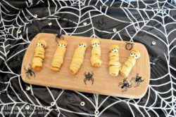 Halloween Mummy Chicken Fries. A fun twist on mummy dogs using crescent rolls and chicken fries.