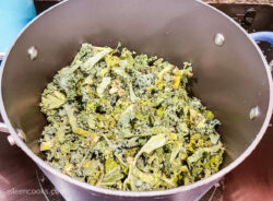 Raw kale inside a large pot.