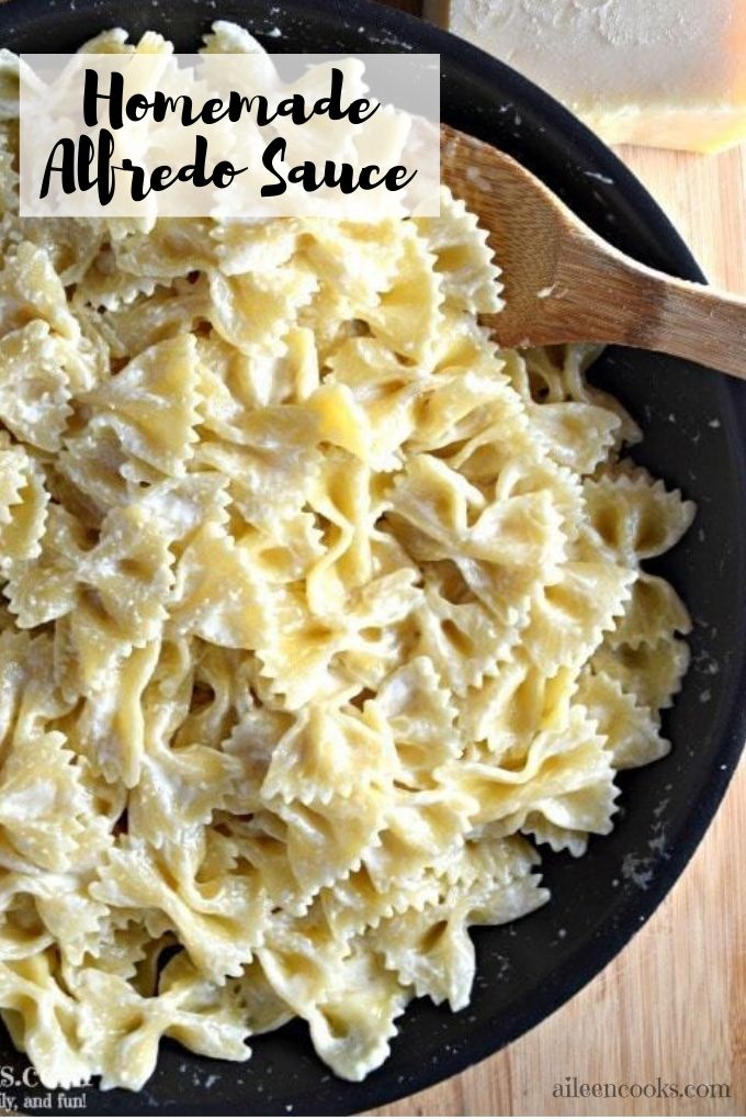 A pan filled with Alfredo Sauce and pasta.