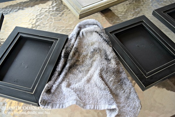 Learn how to spray paint black picture frames white with this easy to follow tutorial!