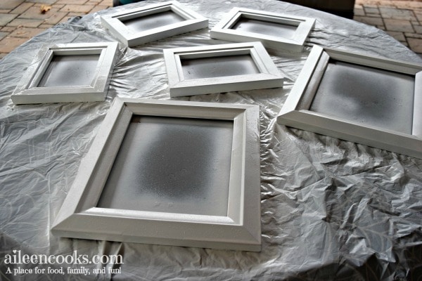 Learn how to spray paint black picture frames white with this easy to follow tutorial!