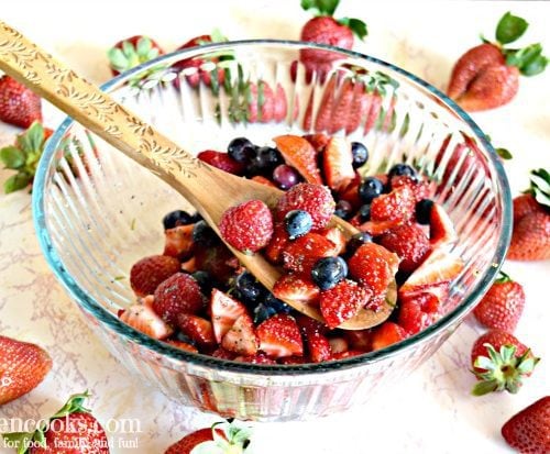 fruit salad with wooden spoon