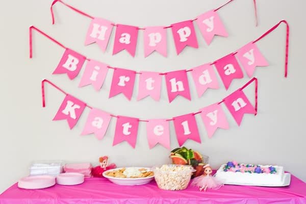 ballerina birthday party banner and food table