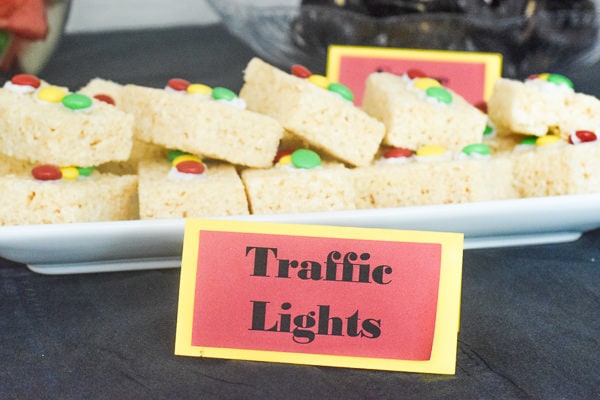 Plate of rice krispie treat traffic lights with name tag "traffic lights" in front that was made with the cricut maker.