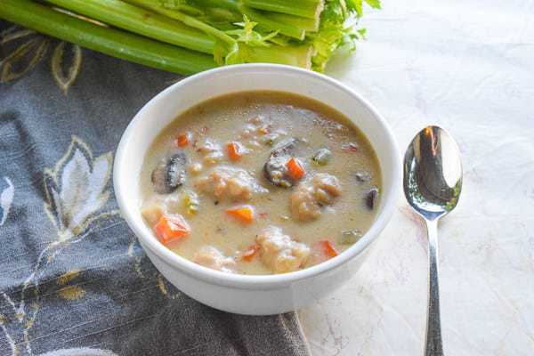 Bowl filled with chicken and dumplings made in the instant pot.