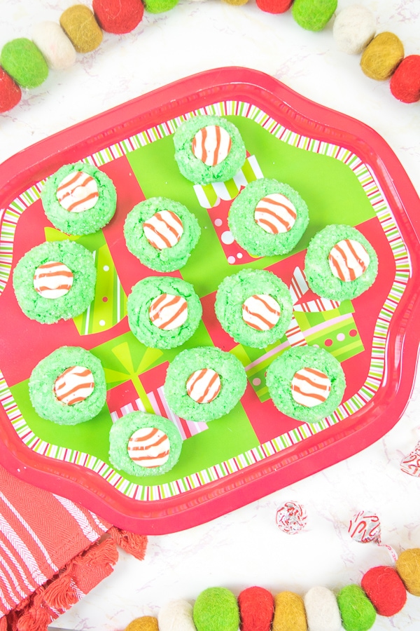 A christmas platter filled with grinch christmas cookies.