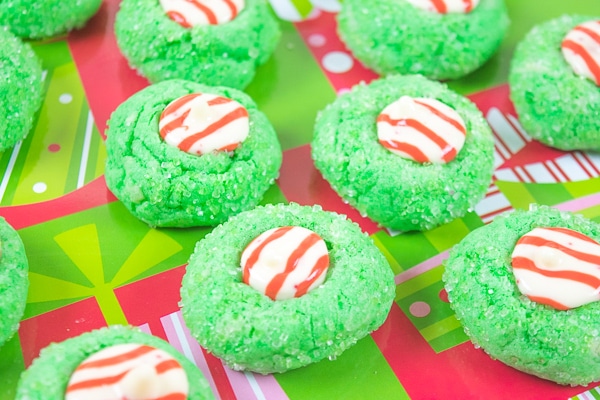 A close up of three grinch blossom christmas cookies.