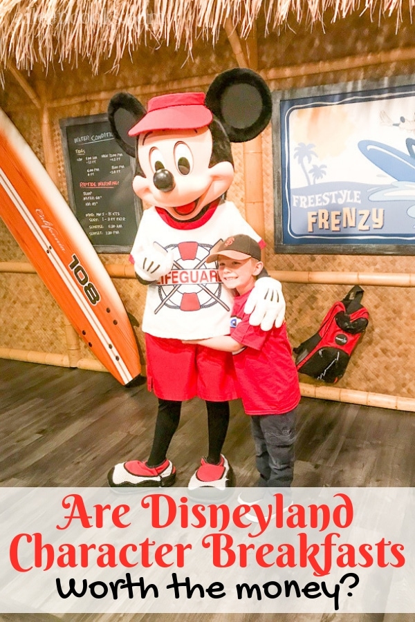 A boy hugging Mickey Mouse during a Disneyland character breakfast.