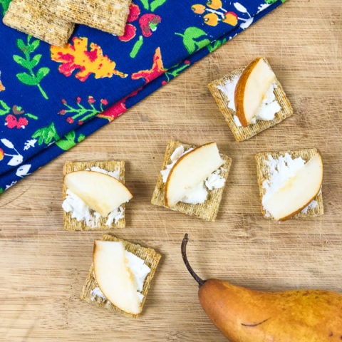 Triscuits topped with goat cheese and sliced pears.