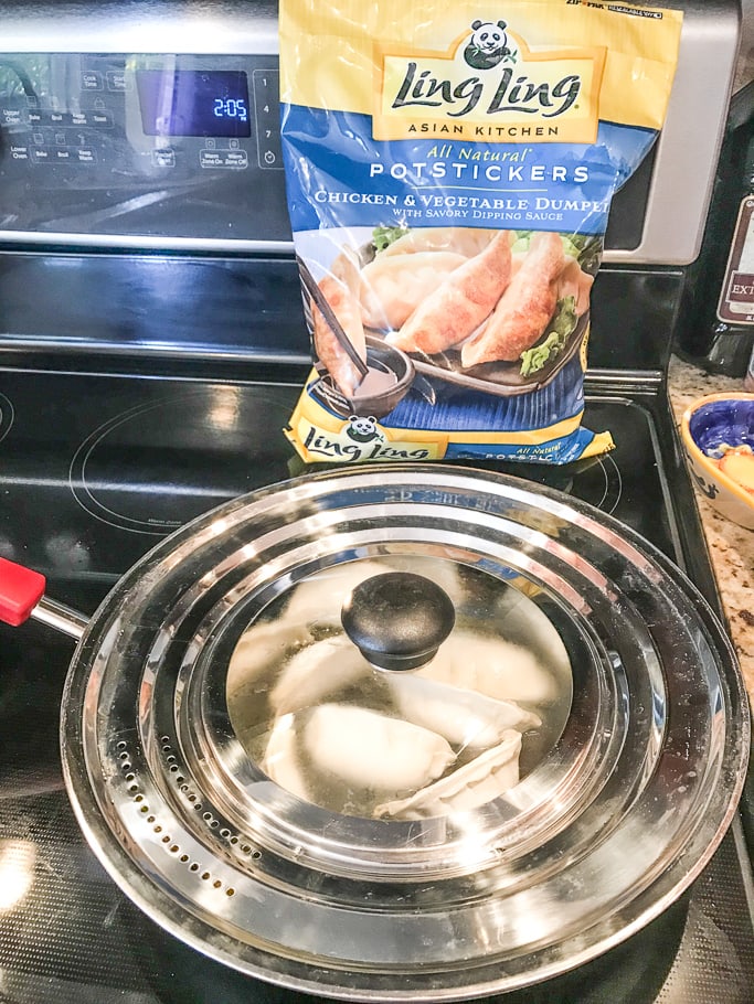 A covered pan of potstickers. 