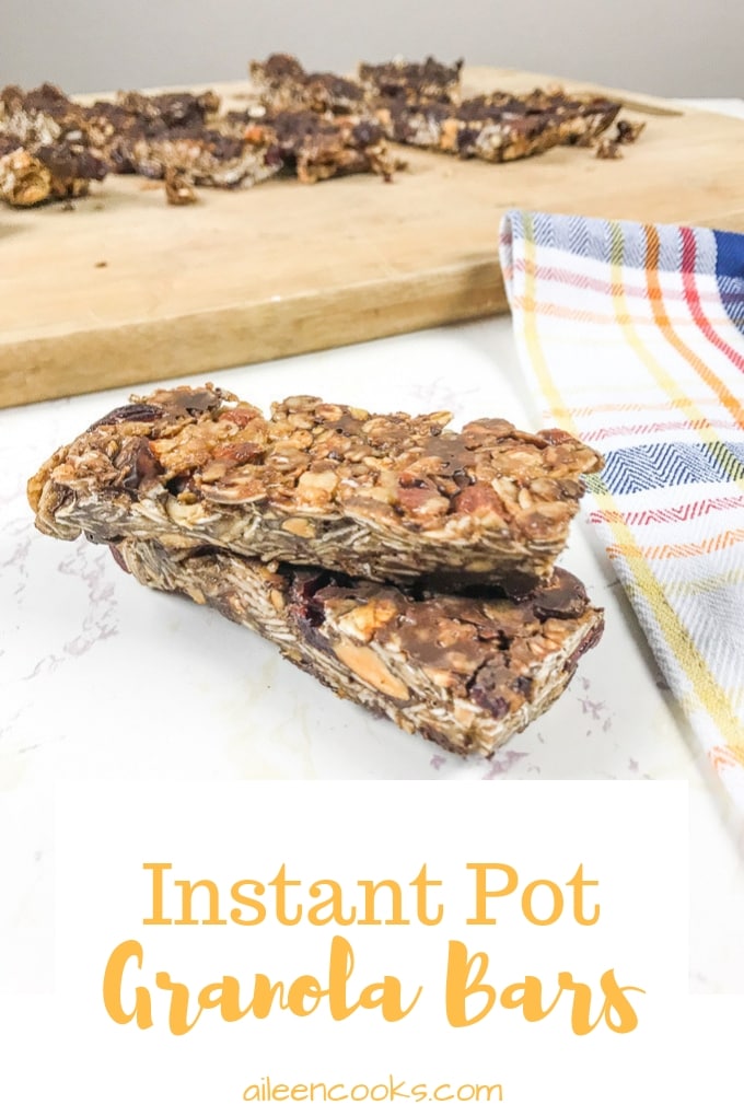 Instant pot granola bars stacked up next to a plaid towel.