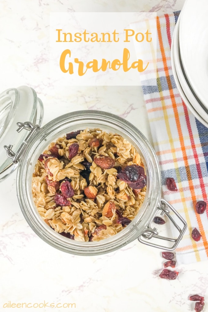 A jar full of instant pot granola with some spilling out onto the counter.