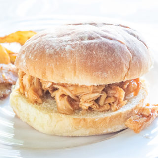 Close up of an instant pot pulled chicken sandwich.
