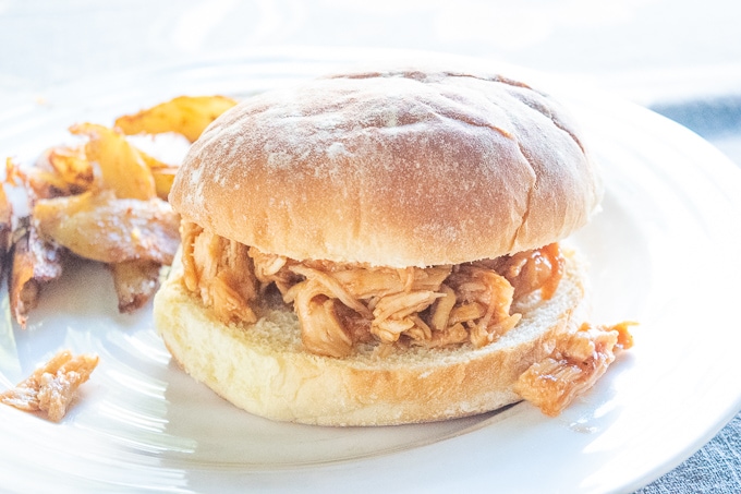 Close up of an instant pot pulled chicken sandwich.